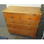 A pine chest of drawers, with two short and three long drawers on bun feet, height 97cm,