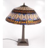 A Tiffany style table lamp with stained leaded glass shade, height 60cm, diameter of shade 50.5cm.