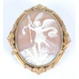 A Victorian carved cameo, depicting St Michael overwhelming the demon, in gilt brooch mount.