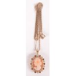 A 9ct gold small cameo pendant set with coloured stones on 9ct gold chain.