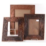 A pair of Aesthetic Movement wooden picture frames, carved with bats, kingfishers and bullrushes,
