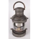 A ship's metal masthead lamp, height 26cm, width 18cm.