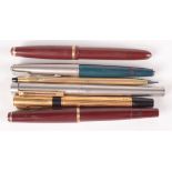 A Mont Blanc 32 burgundy fountain pen, an Onoto burgundy fountain pen,