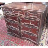 A late 17th century or early 18th century oak and fruitwood chest,