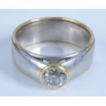 A yellow and white gold contemporary ring set a solitaire diamond of approximately 1ct, 16.8g.