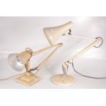 Two cream painted anglepoise lamps.