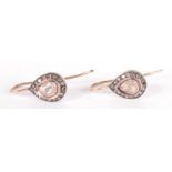 A pair of pear shaped rose diamond set earrings,