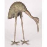 A Japanese bronze figure of a crane, late 19th/early 20th century, height 28.5cm, width 27cm.