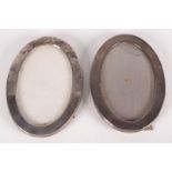 A pair of plain oval silver mounted photograph frames Birmingham 1919, 11 x 16.2cm.