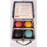 A set of four croquet balls, black, blue, red and yellow, in the original Slazengers Stadium box,