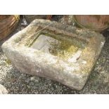 A rectangular granite trough, height 27cm, length 58cm, width 40cm.