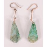 A pair of Chinese carved jade earrings.