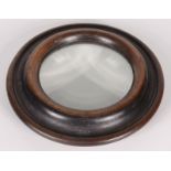An oak table top circular magnifying glass, 19th century, diameter 18.5cm.