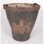 A leather fire bucket, 19th century, with a leather handle and painted with a coat of arms,
