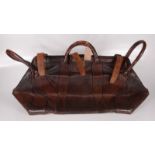 A leather bullion bag, with a metal lined top and four handles, height 40cm, length 73cm,