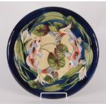 A Moorcroft pottery 'Quiet Waters' pattern charger, shape 787, by Philip Gibson,