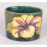 A Moorcroft pottery 'Hibiscus' pattern oval jar,