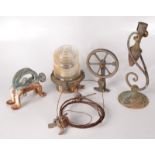 A ship's glass and metal light and other marine items.