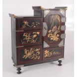 A Japanese black lacquered table cabinet, late 19th century,