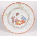 A Chinese famille rose porcelain plate, 18th century, decorated with a lady and her attendants,