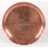 A Newlyn copper circular tray, decorated to the centre with St Michaels Mount, impressed 'Newlyn',