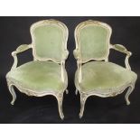 A pair of Louis XV open armchairs.