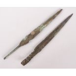 Two bronze blades, one with a guarantee from the Fossil Shop, Hexham stating it to be Roman,