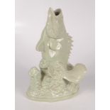 A Chinese celadon glazed porcelain figure of a fish, early 20th century, impressed mark to base,