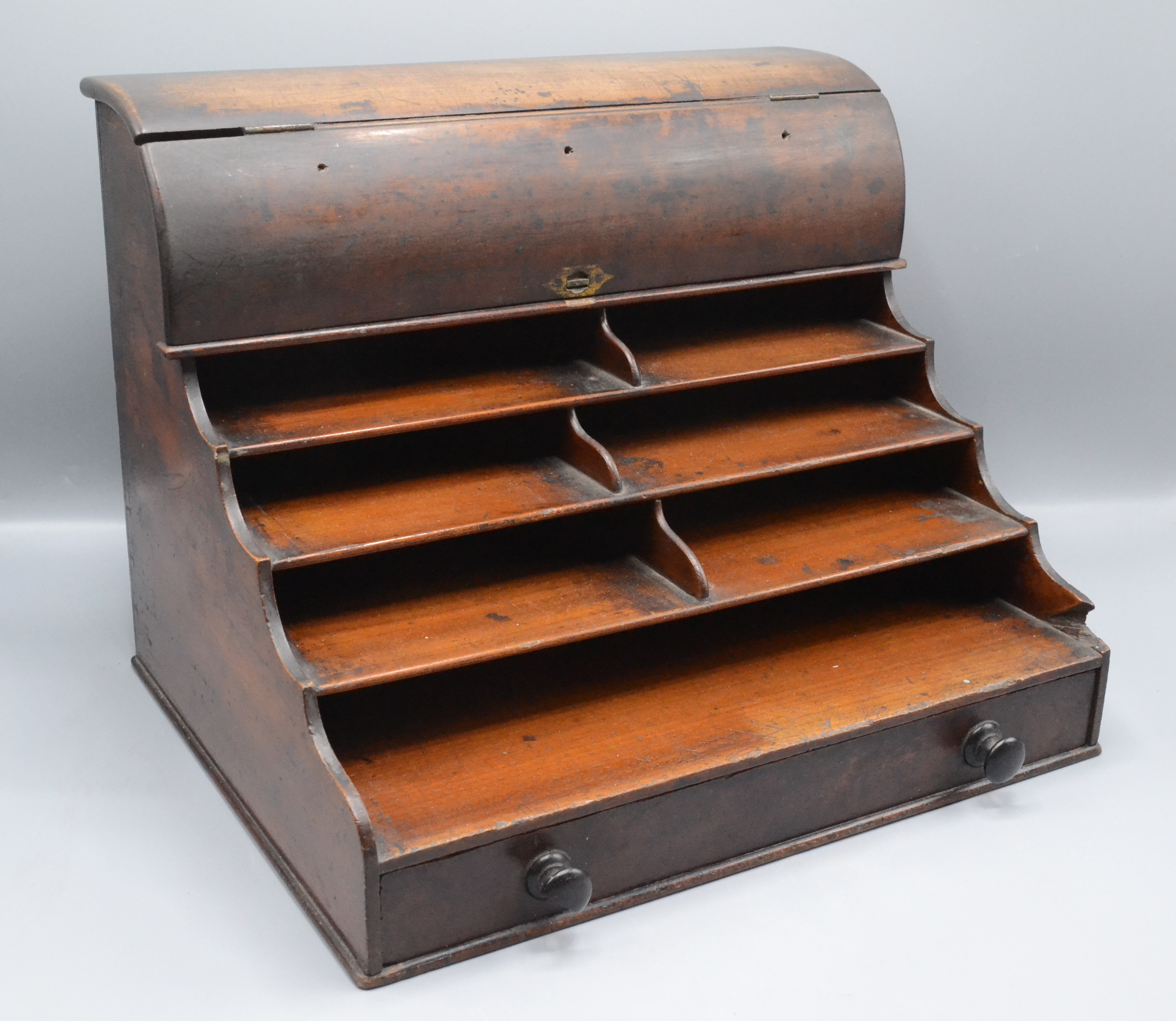 A mahogany stationary cabinet, 19th century, the hinged cover opening to reveal three compartments,