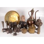 An Islamic tinned copper ewer, height 37cm, other eastern brassware, ebony elephants etc.