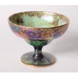A Wedgwood Fairyland lustre footed bowl, the green mottled interior gilt decorated with gnomes,