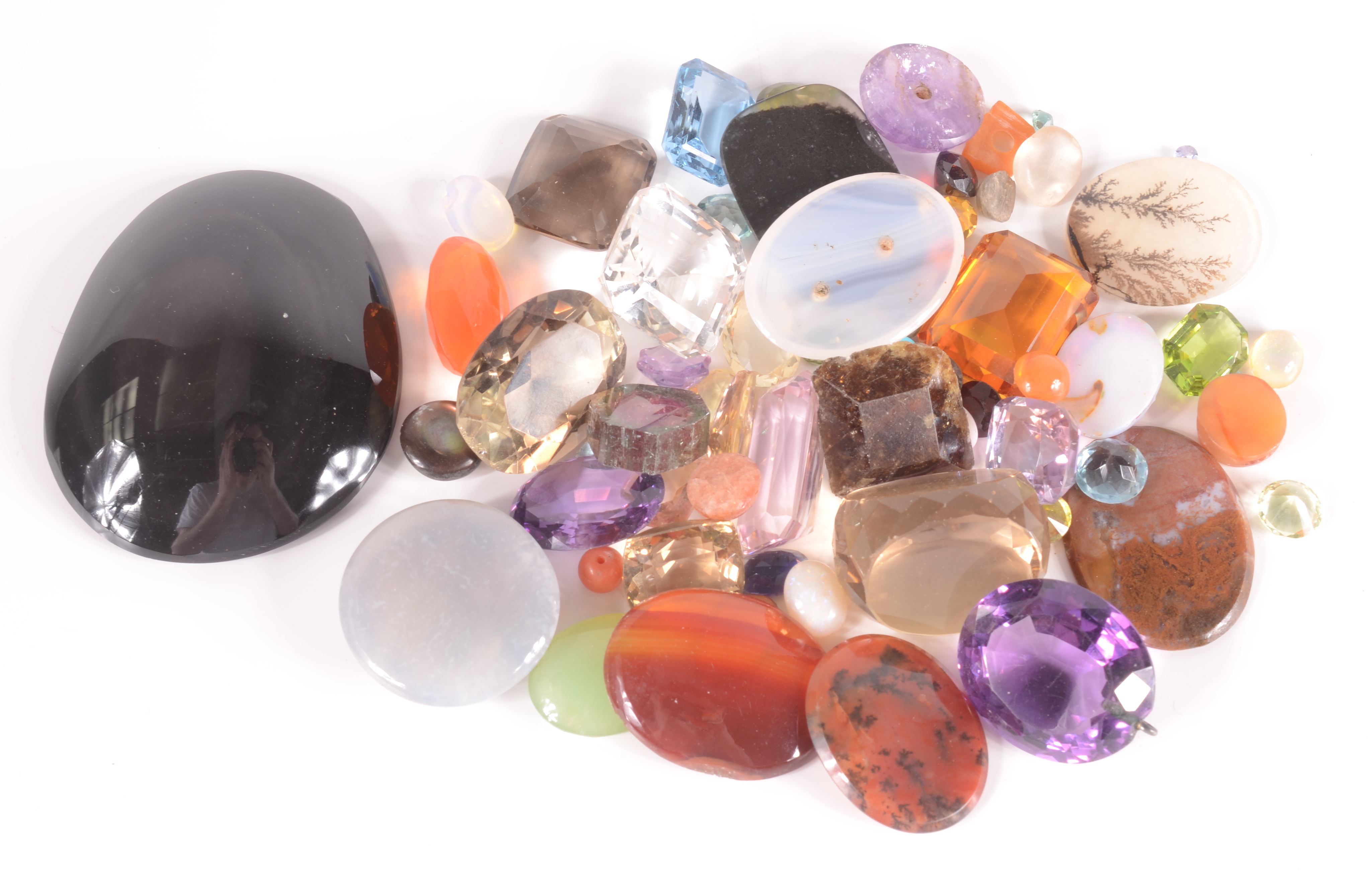 A quantity of cut and polished unmounted stones.