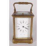 A brass repeater carriage clock, the white enamel dial with roman numerals, height 11cm, width 6.