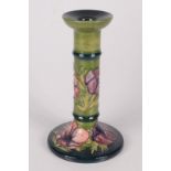 A Moorcroft pottery 'Anemone On Green'' pattern candlestick, shape 849, by Walter Moorcroft,