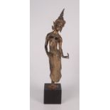 A South East Asian gilt bronze figure of a dancing lady, on a square wooden plinth, full height 39.