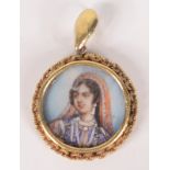 An Indian very high purity gold pendant, set with a finely painted portrait of a princess.