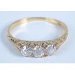 A Victorian style 18ct gold ring set with three diamonds.
