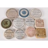 Eleven toothpaste pot lids, including Woods Areca Nut, An Admirable Dentifrice Cherry and J.