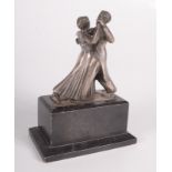 A ballroom dancing sculptural silver plated trophy on a rectangular wooden plinth base, height 19cm.