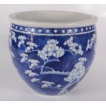 A Chinese blue and white prunus pattern jardiniere, 19th century, height 22.3cm, diameter 26cm.