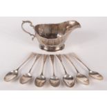 A set of seven George III engraved silver teaspoons, different dates and makers,