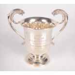 A Point to Point silver trophy cup, the twin scrolling handles with dragon head finials, 10.
