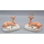 A pair of Staffordshire pottery pen holders, in the form of seated deers, height 12cm, width 11.5cm.