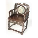 A Chinese hardwood armchair, 19th century, with floral mother of pearl decoration,