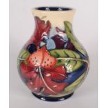 A Moorcroft pottery 'Simeon' pattern vase, of baluster form, shape 869, by Philip Gibson,