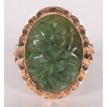 A Chinese carved jade 14ct gold ring.