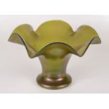 An iridescent green glass bowl, with wavy rim, height 20.5cm, diameter 13.3cm.