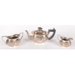 An embossed late Victorian three piece silver tea service by Elkington, Birmingham 1898, 18.8oz.