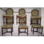 A set of six Victorian walnut ship's chairs, the top rail with an inset brass oval numerical plaque,