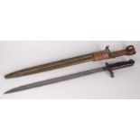 A WWI US Remington 1918 bayonet, with green painted metal and brown leather scabbard,
